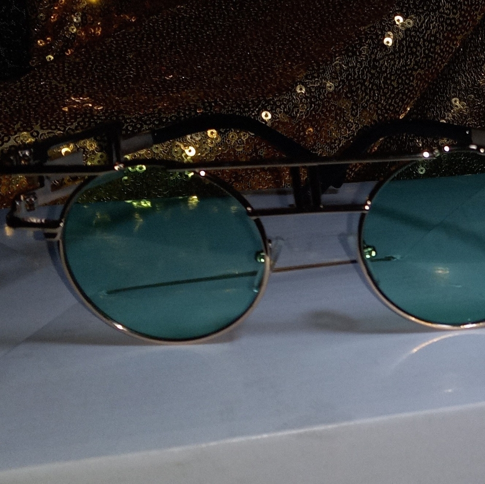 High fashion sunglasses with green tint